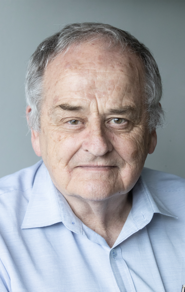 Mike Styles in a pale blue shirt.