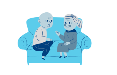 older man and woman sat on a sofa talking