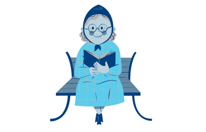 older woman sat on a park bench with a book 