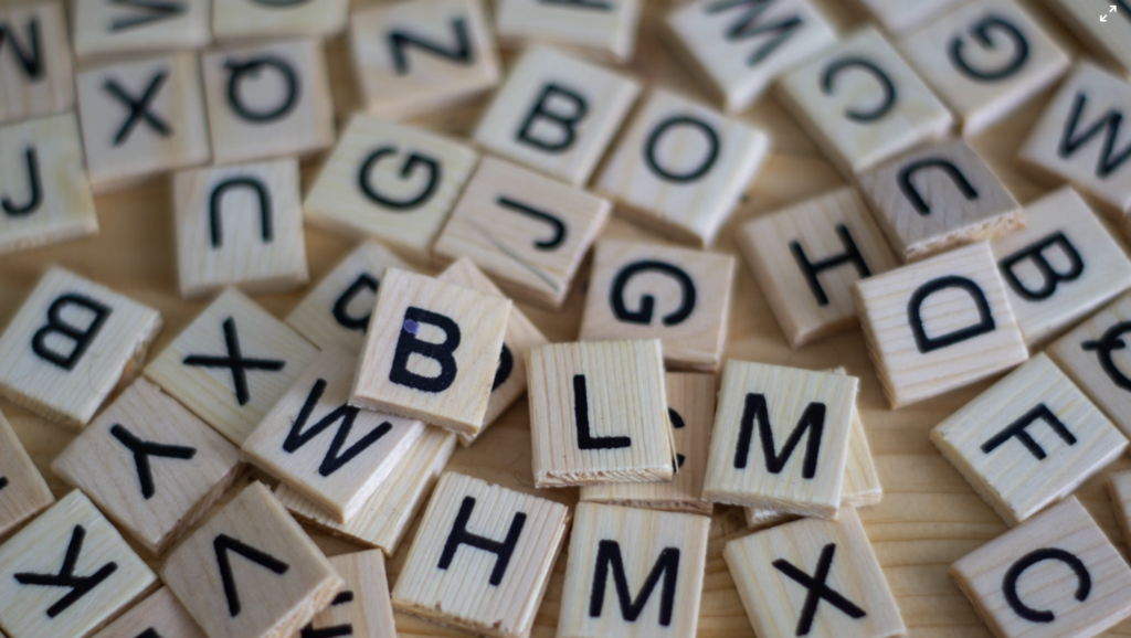 a jumble of scrabble letter tiles 