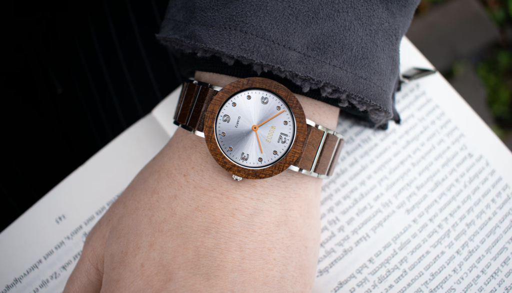 a hand and a wristwatch