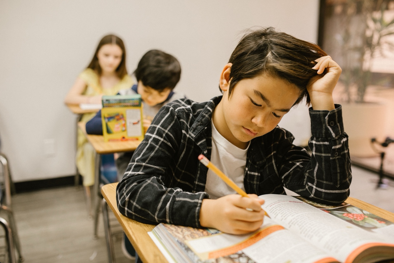 Boy working at a school desk